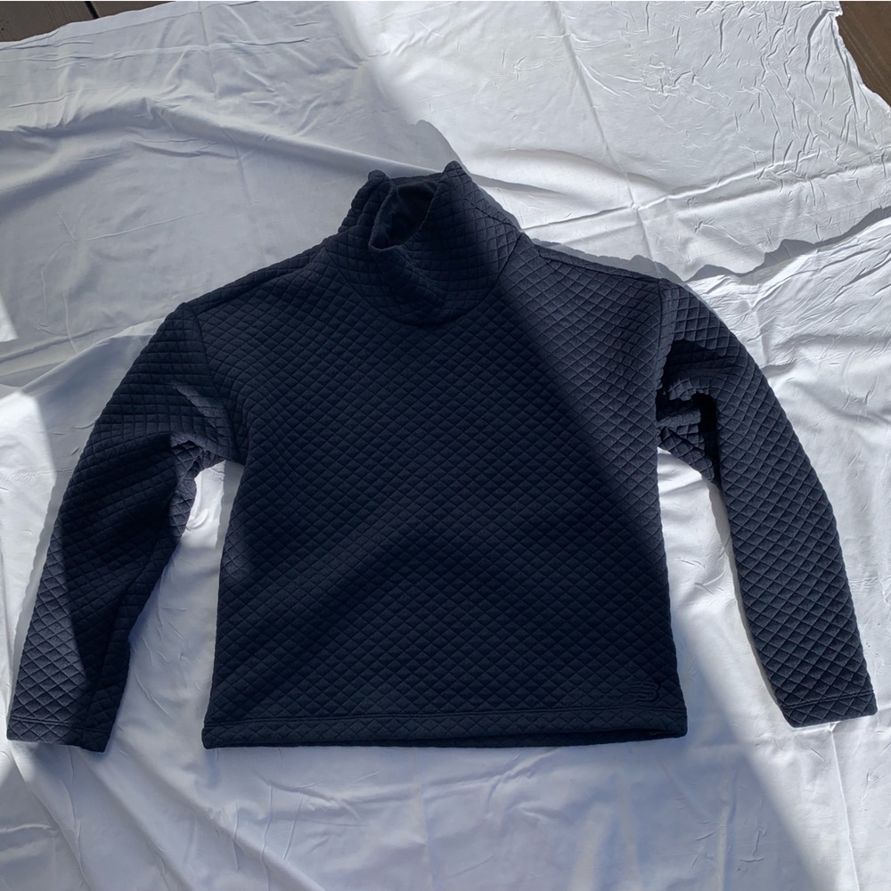 NEVER been worn.  New Balance pullover w adjustable waist band.  Navy